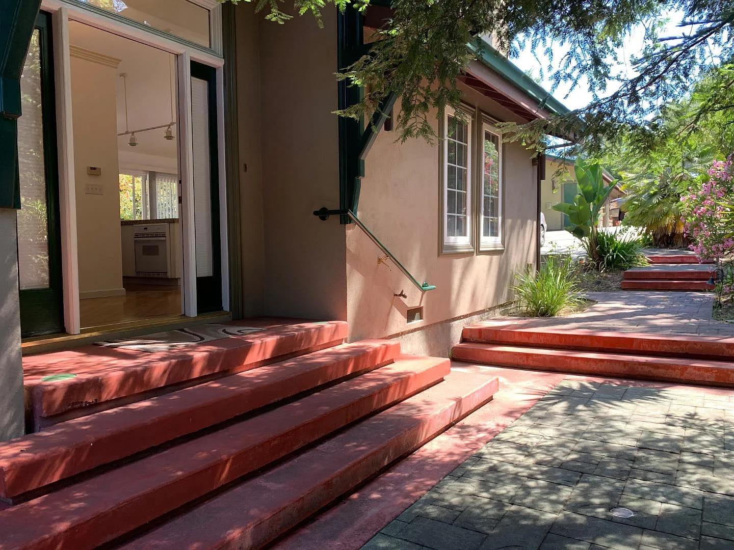 2360 Woodside Road, Unit A Woodside, CA 94062 - Photo 1 of 27 a backyard of a house with wooden floor and outdoor seating