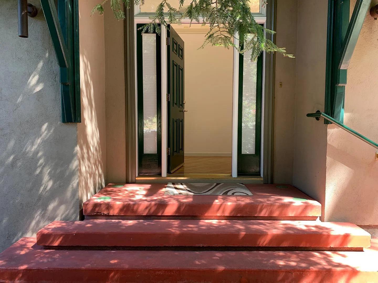 2360 Woodside Road, Unit A Woodside, CA 94062 - Photo 2 of 27 a bedroom with a bed and a potted plant