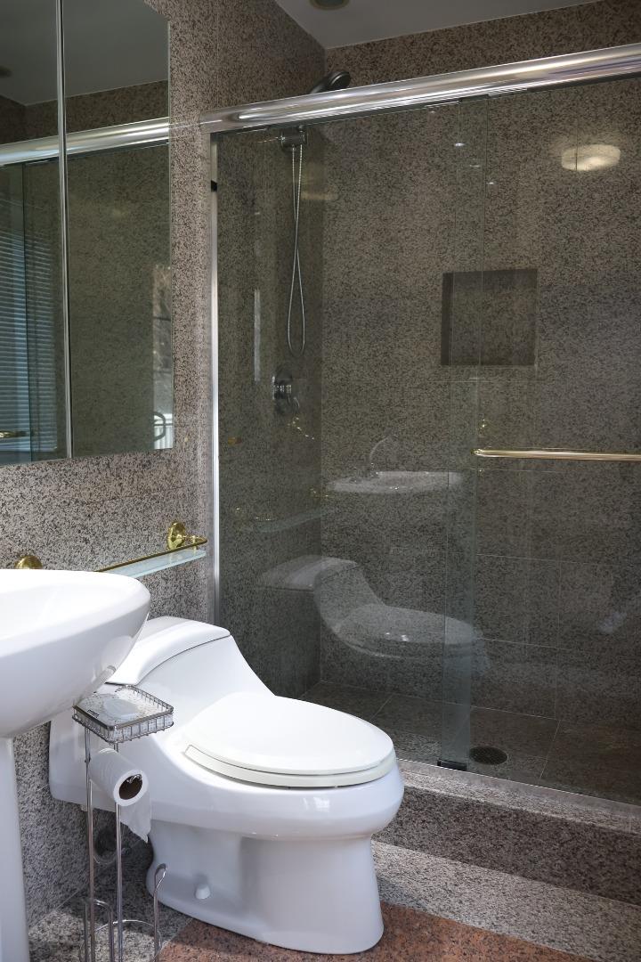 2360 Woodside Road, Unit A Woodside, CA 94062 - Photo 24 of 27 a white toilet sitting next to a bath tub and shower