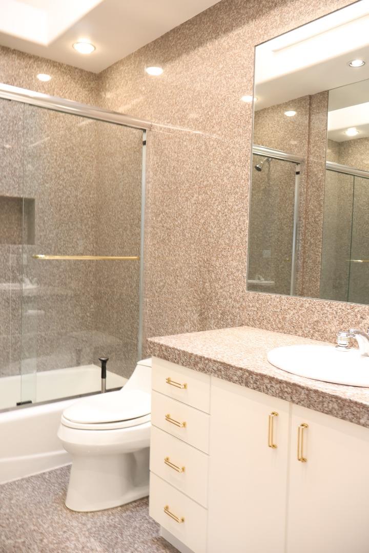 2360 Woodside Road, Unit A Woodside, CA 94062 - Photo 25 of 27 a bathroom with a granite countertop sink toilet and shower