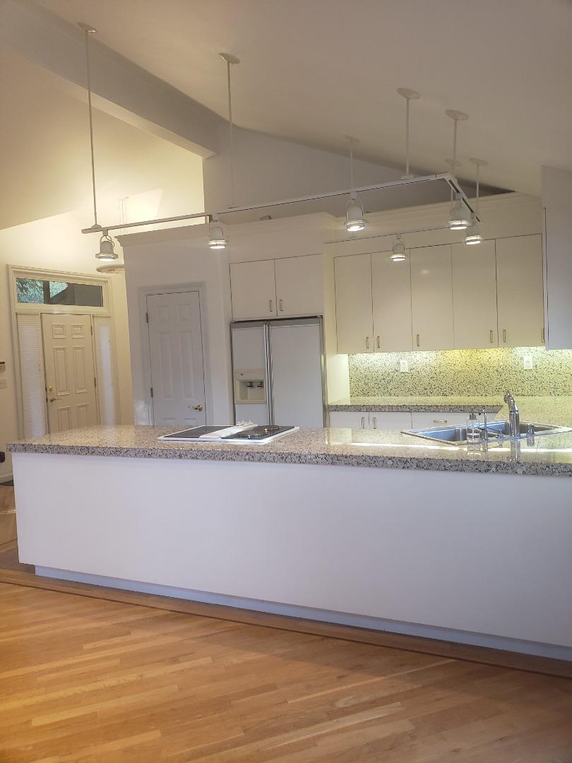 2360 Woodside Road, Unit A Woodside, CA 94062 - Photo 27 of 27 a view of a kitchen with kitchen island and stainless steel appliances