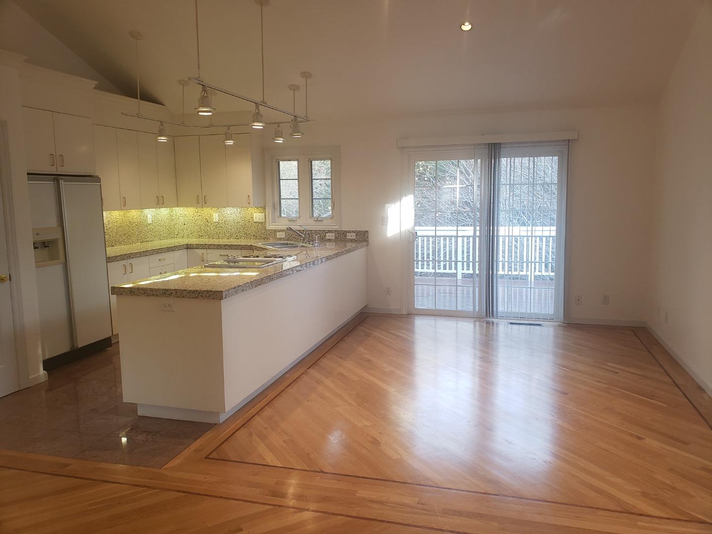 2360 Woodside Road, Unit A Woodside, CA 94062 - Photo 7 of 27 a large kitchen with stainless steel appliances granite countertop a stove a sink and a refrigerator