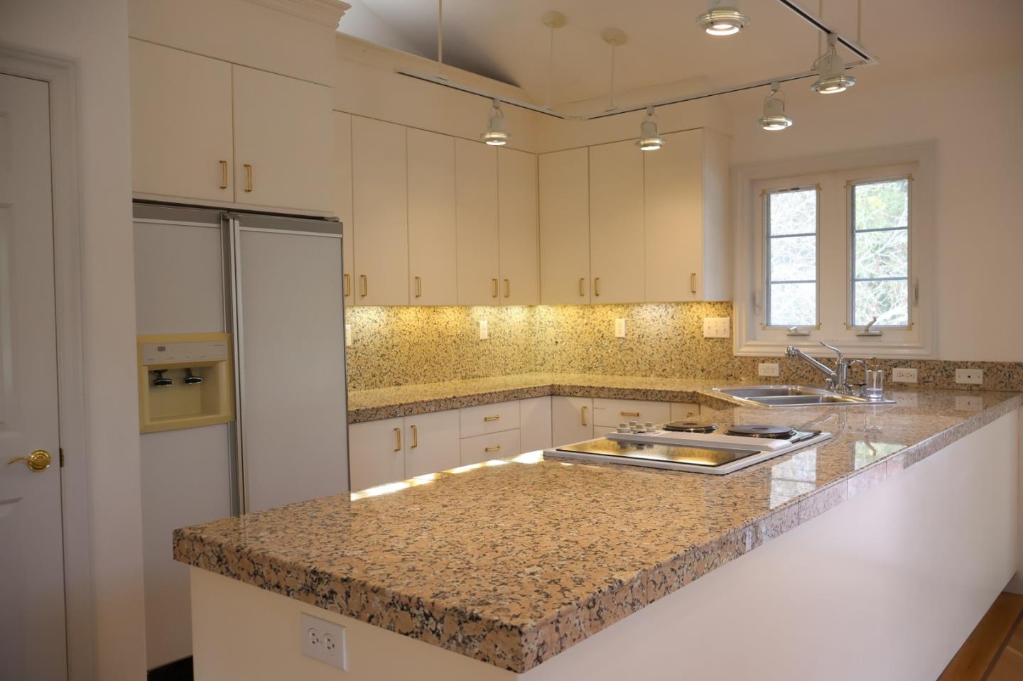 2360 Woodside Road, Unit A Woodside, CA 94062 - Photo 8 of 27 a kitchen with a sink stove and refrigerator