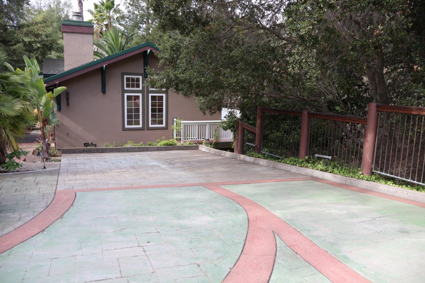 2360 Woodside Road, Unit A Woodside, CA 94062 - Photo 10 of 27 a backyard of a house with yard and garage