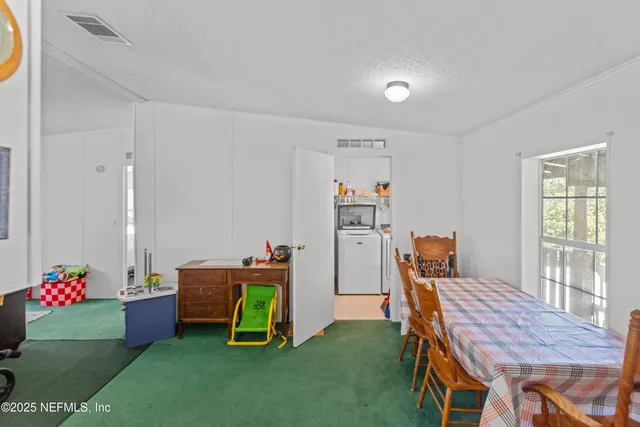 a view of a workspace with furniture and toys