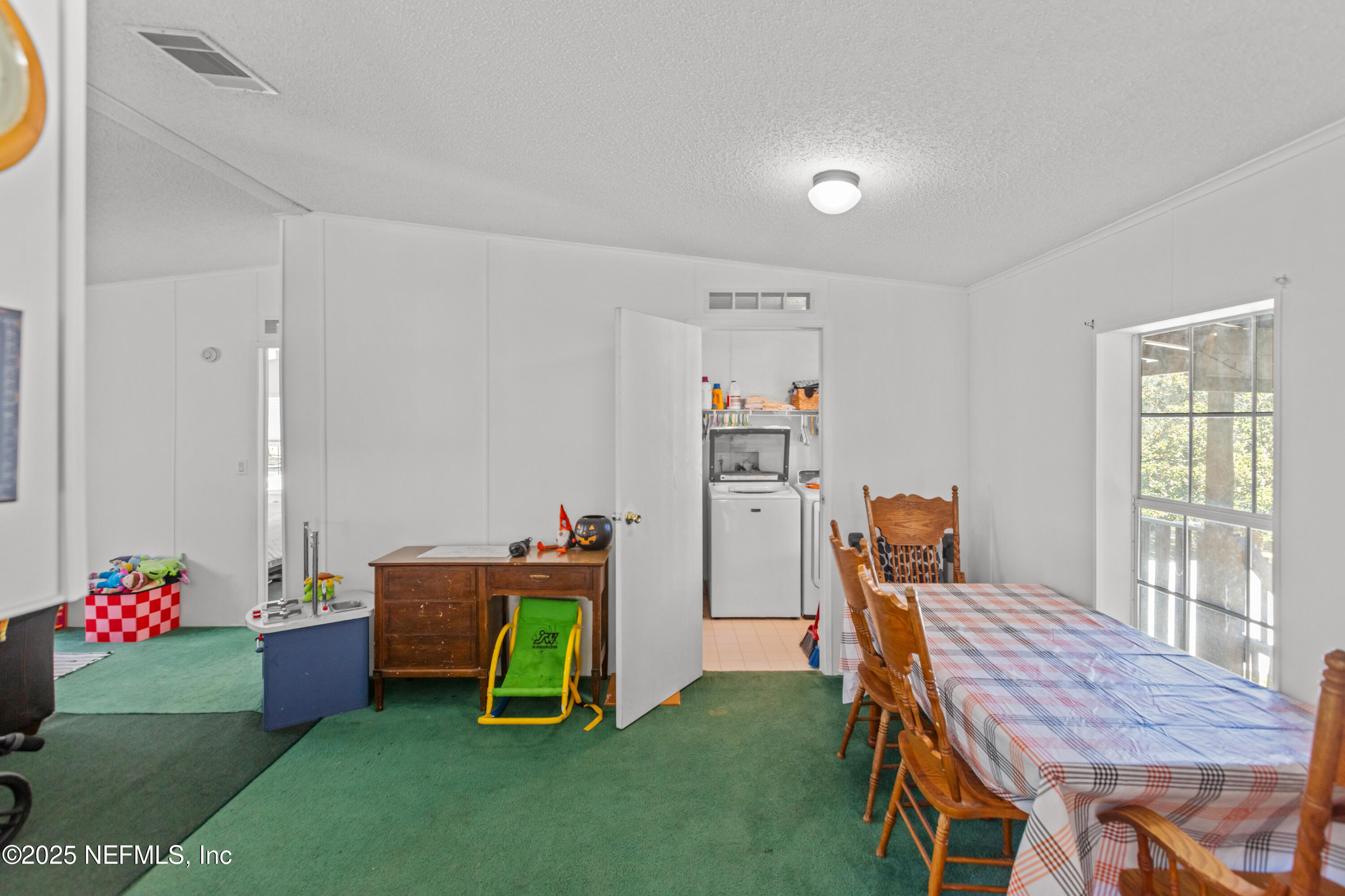 6279 Little Lake Geneva Road Keystone Heights, FL 32656 - Photo 12 of 45 a view of a workspace with furniture and toys