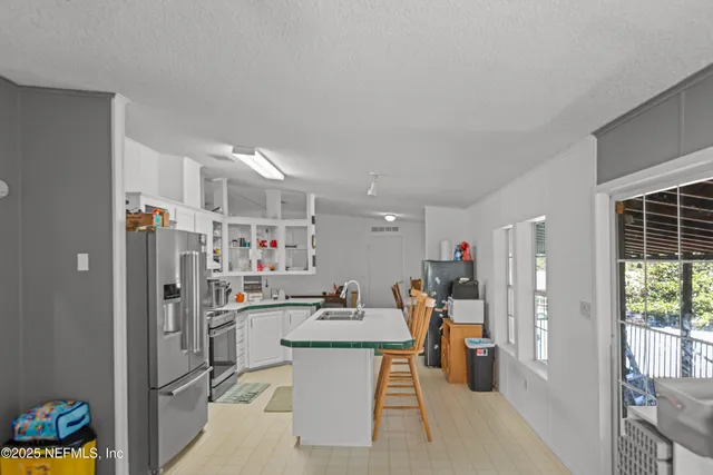 a view of a kitchen and dining room