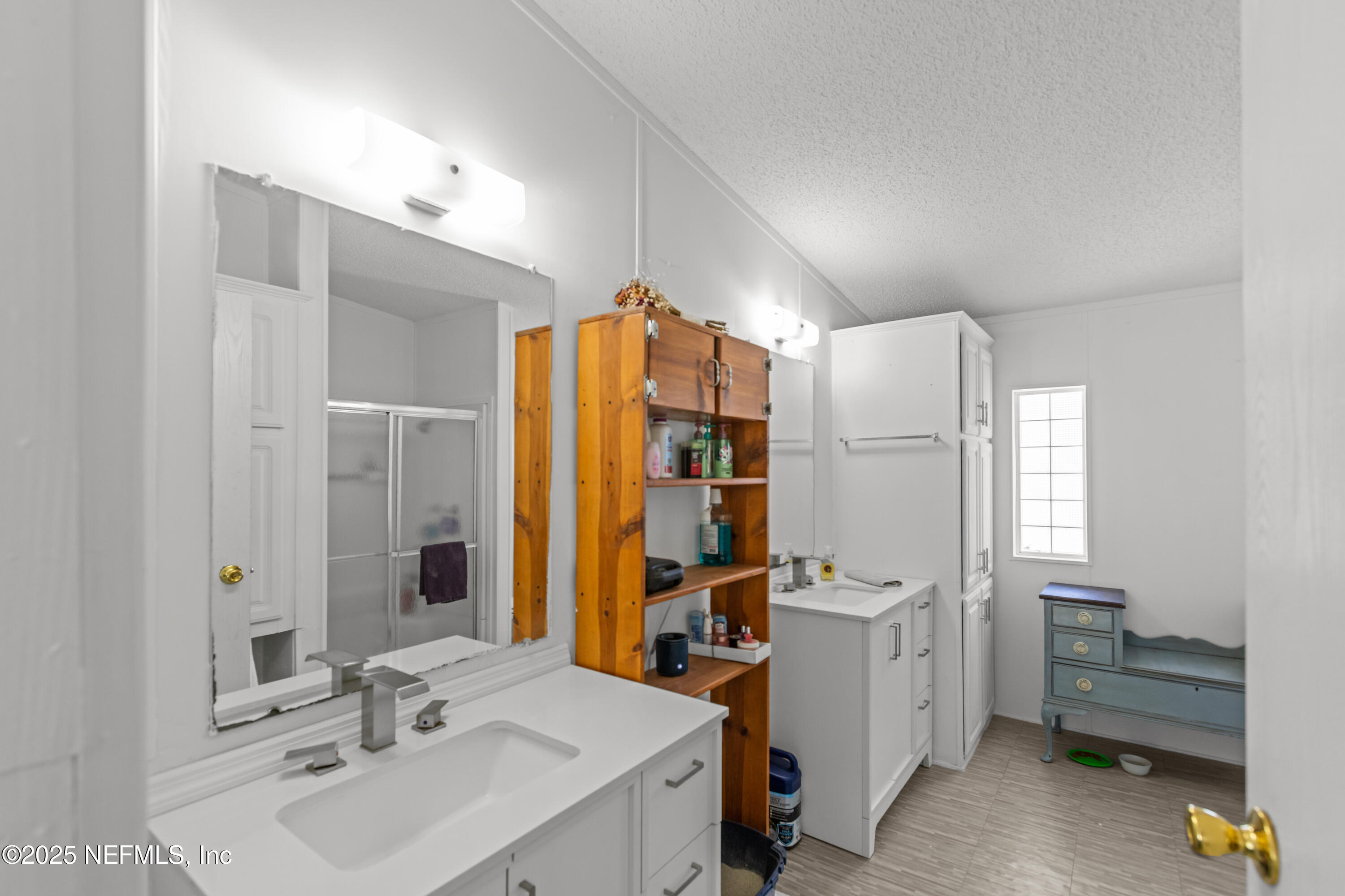 6279 Little Lake Geneva Road Keystone Heights, FL 32656 - Photo 22 of 45 a bathroom with a sink double vanity and a mirror