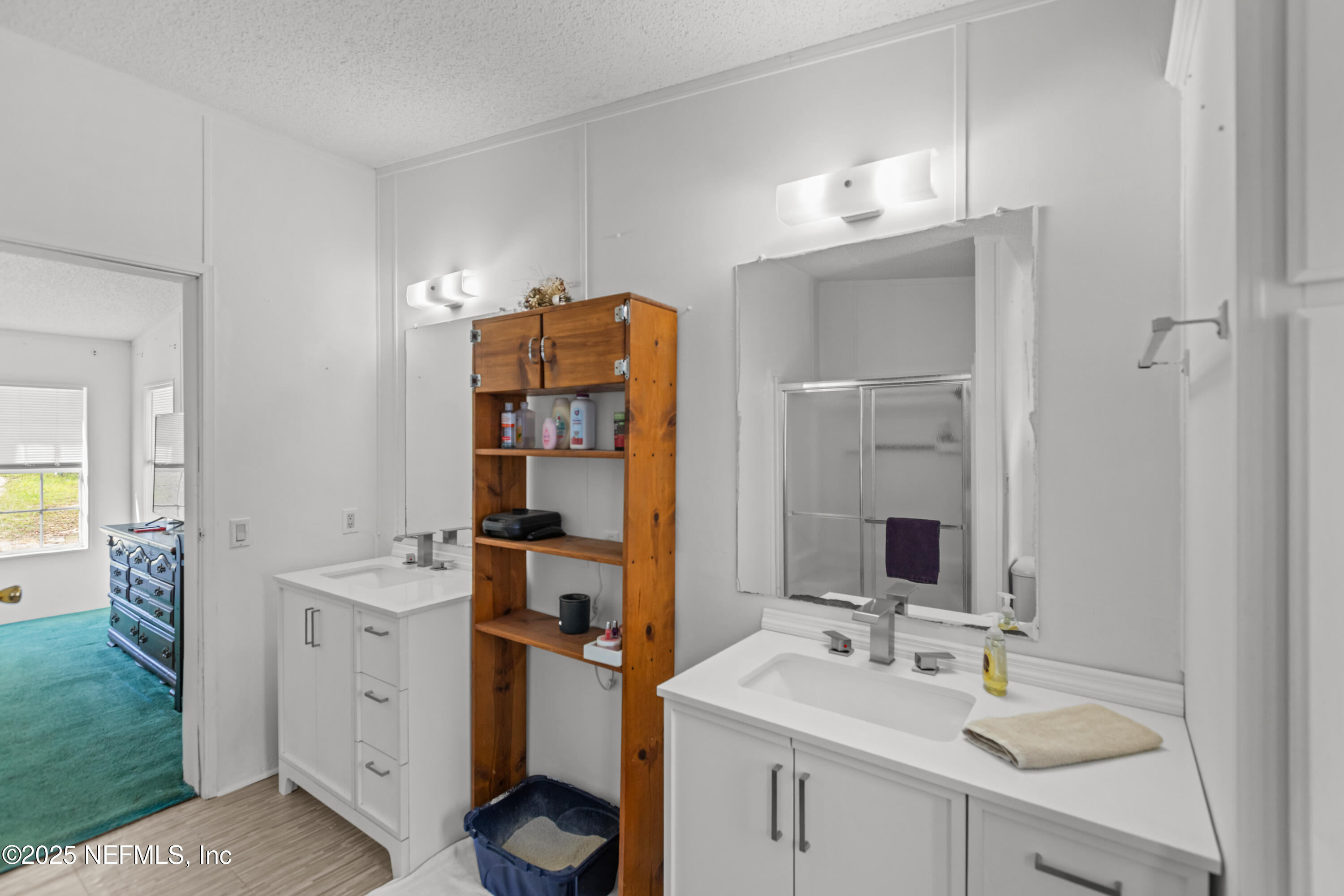 6279 Little Lake Geneva Road Keystone Heights, FL 32656 - Photo 25 of 45 a bathroom with a sink and a mirror