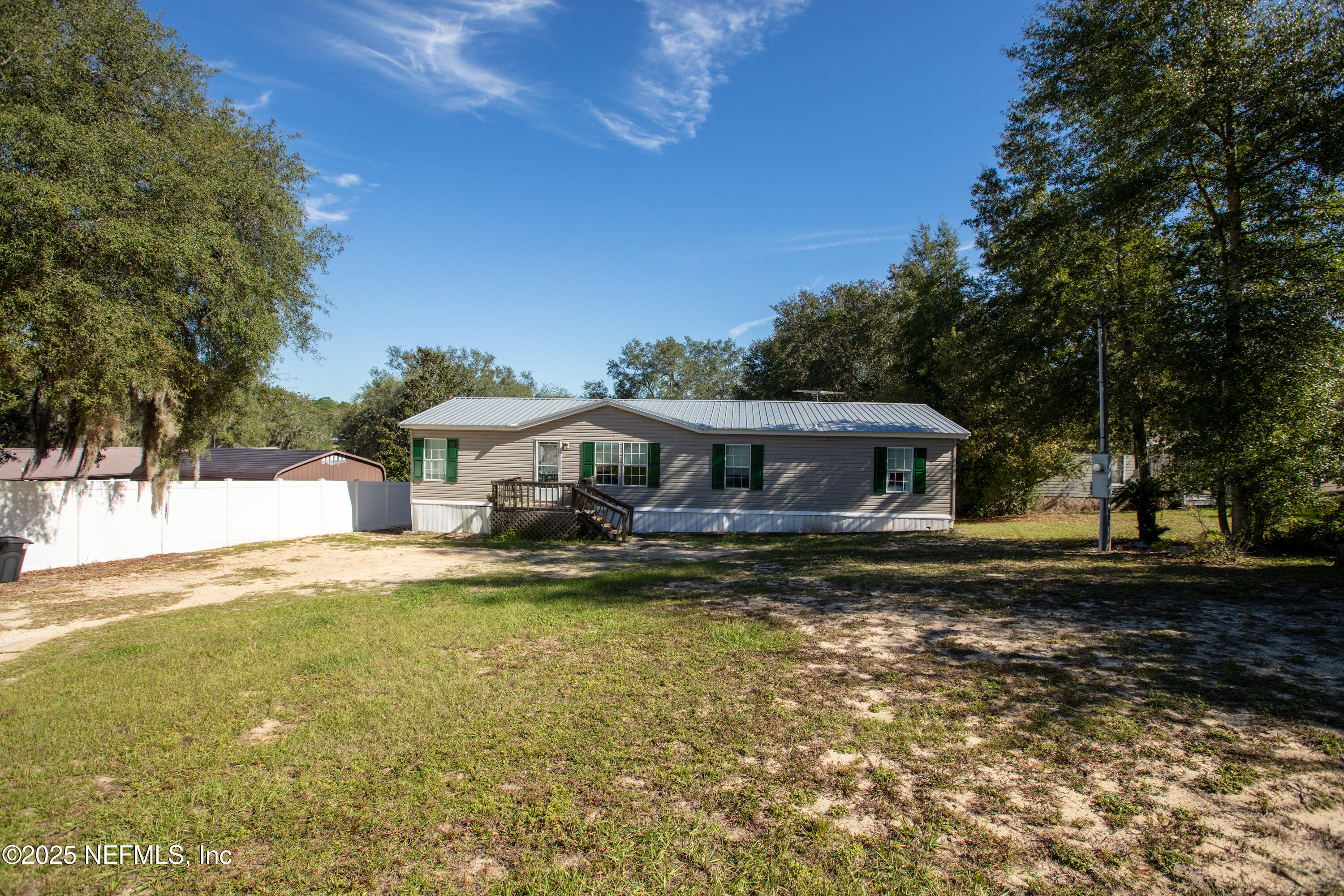 6279 Little Lake Geneva Road Keystone Heights, FL 32656 - Photo 34 of 45 a view of a house with a yard