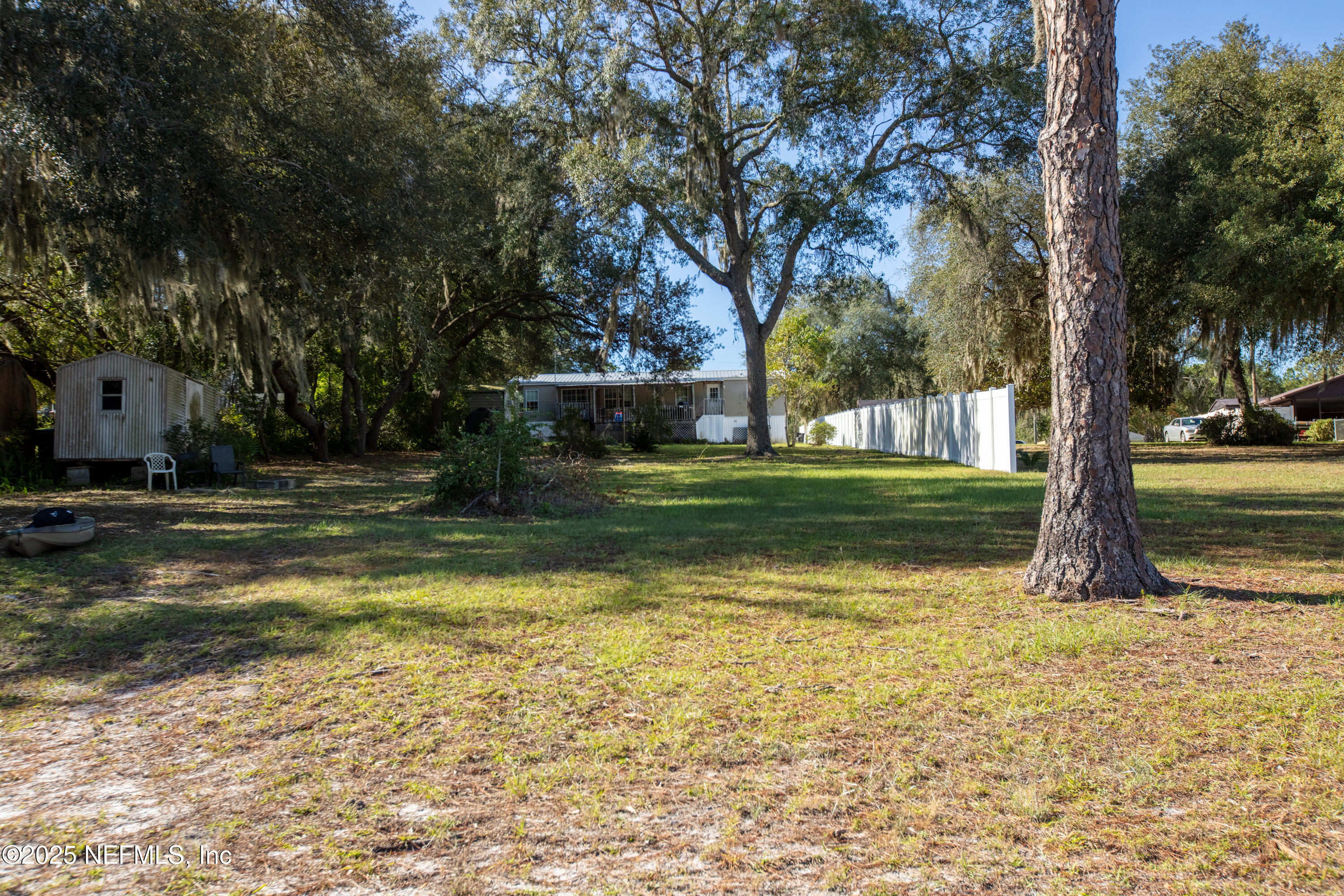 6279 Little Lake Geneva Road Keystone Heights, FL 32656 - Photo 35 of 45 a view of a yard with swimming pool