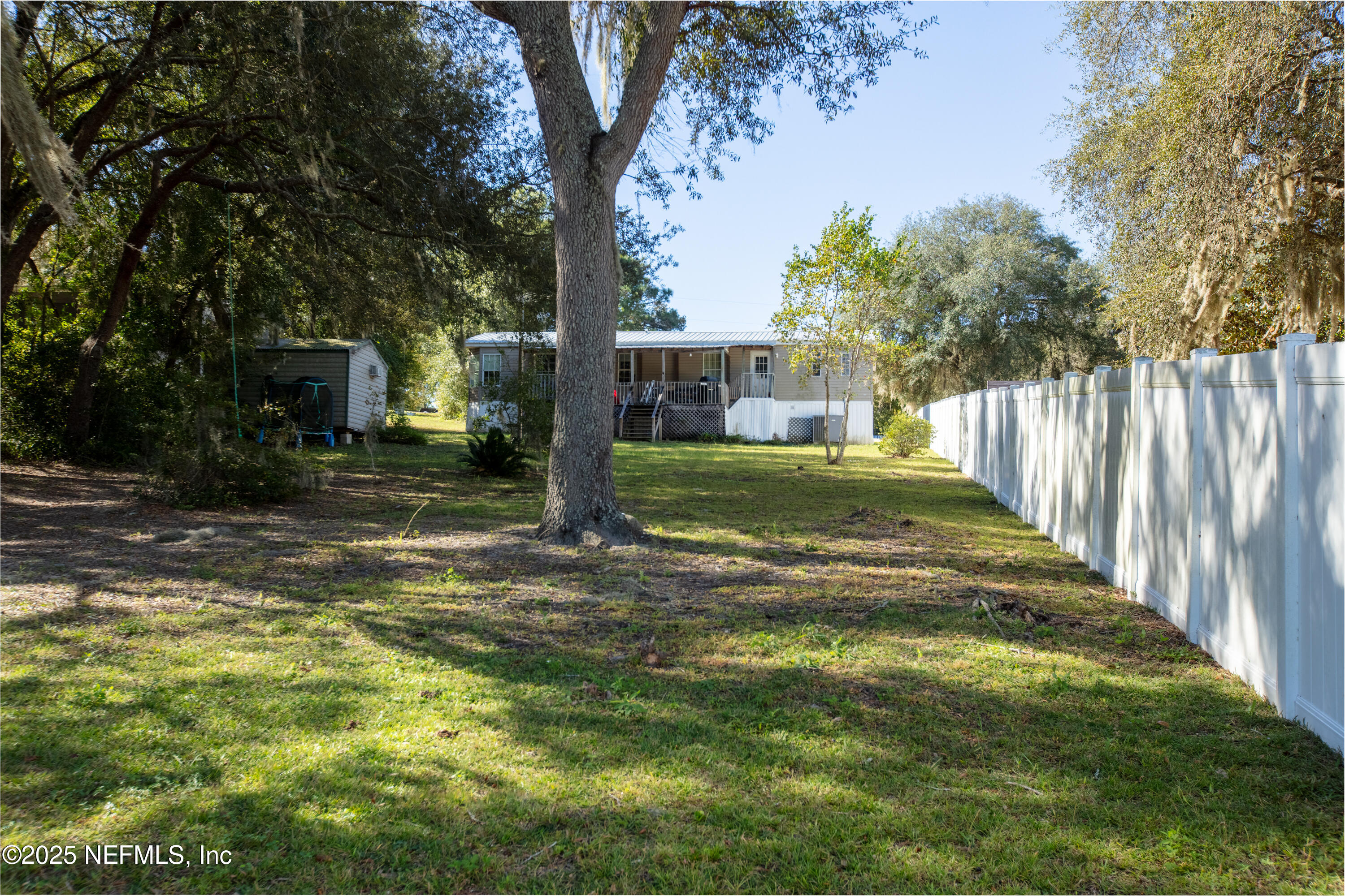 6279 Little Lake Geneva Road Keystone Heights, FL 32656 - Photo 36 of 45 a view of a yard with plants and trees