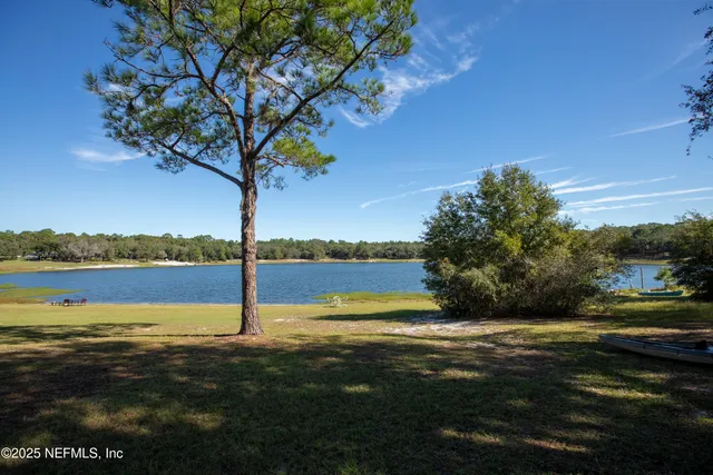 a view of a lake with a big yard