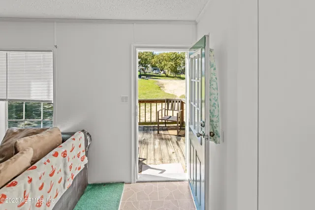 a bedroom with furniture and a window
