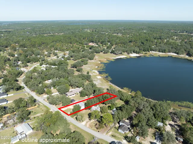 an aerial view of residential houses with outdoor space and seating
