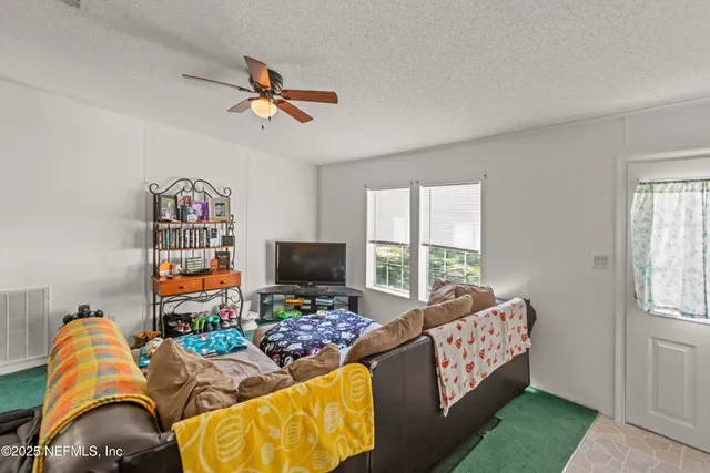 a bedroom with furniture and a window