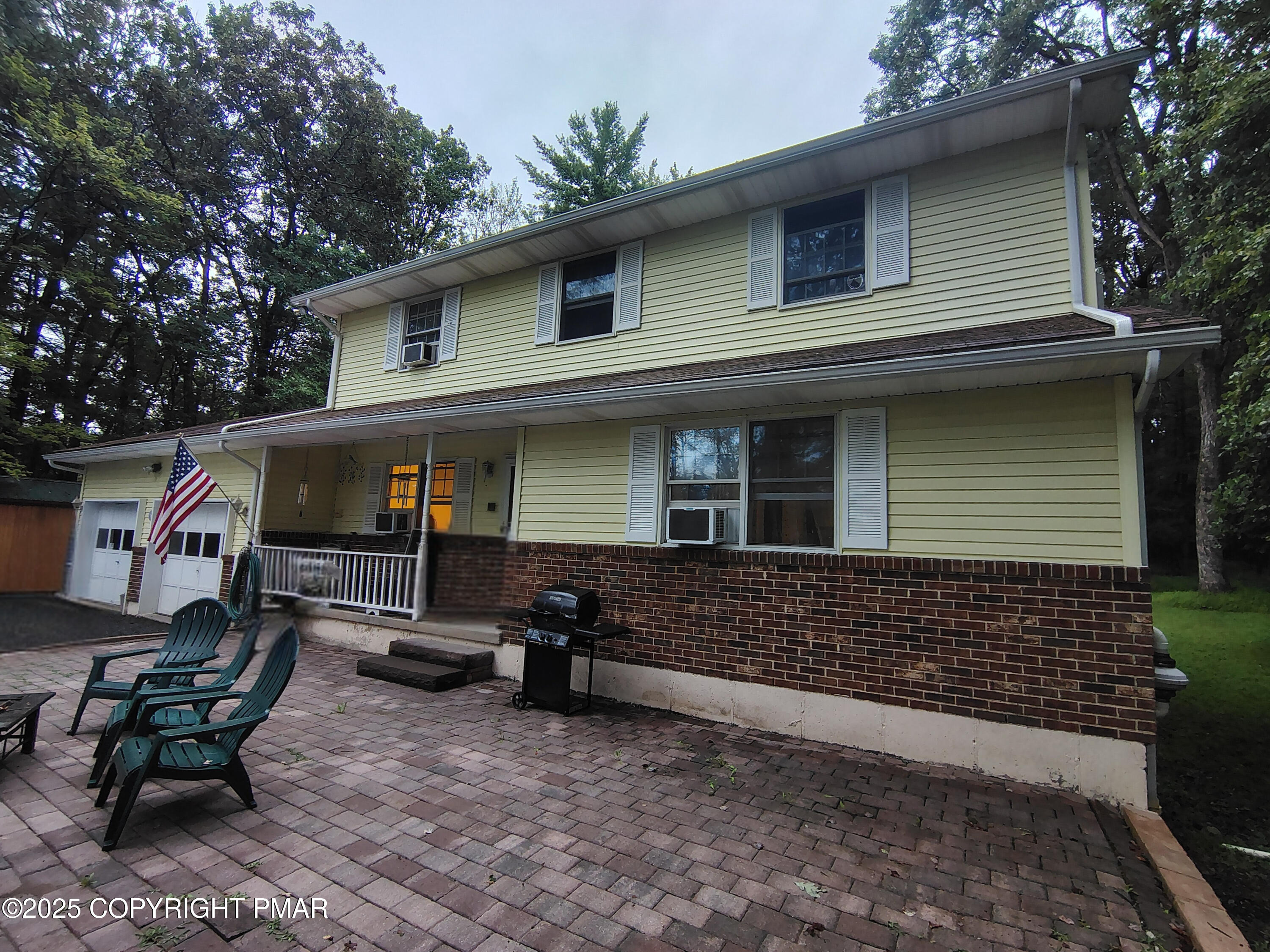 587 Long Mountain Road Effort, PA 18330 - Photo 22 of 29 a front view of a house with chair and tables