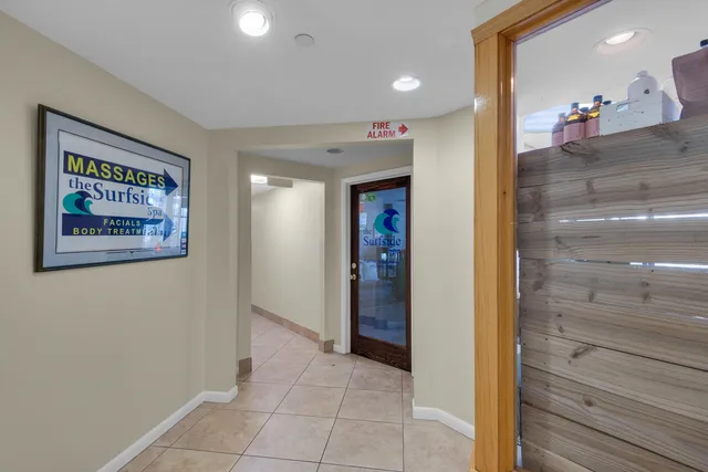 a living room with furniture a rug and a chandelier