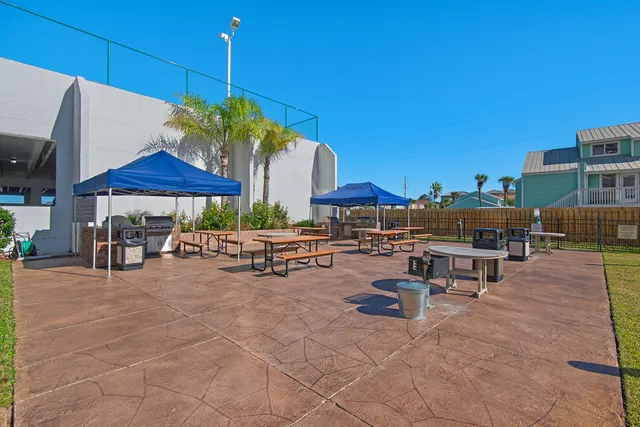 a view of a backyard with furniture and a table