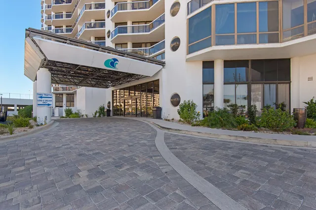 a view of a building with a yard