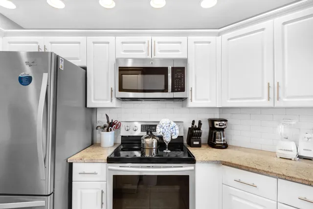 a view of a hallway with wooden floor and entryway