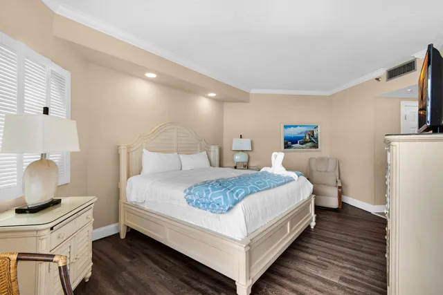 a bathroom with a granite countertop sink mirror vanity and toilet