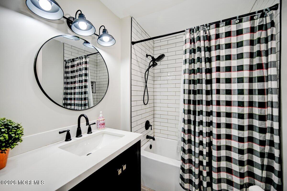 6 Meadowbrook Drive Howell, NJ 07731 - Photo 13 of 24 a bathroom with a sink and a mirror