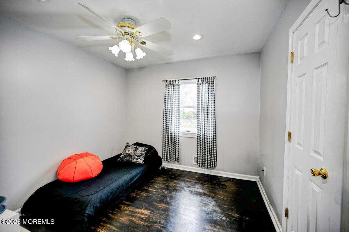 6 Meadowbrook Drive Howell, NJ 07731 - Photo 15 of 24 wooden floor in an empty room with a window