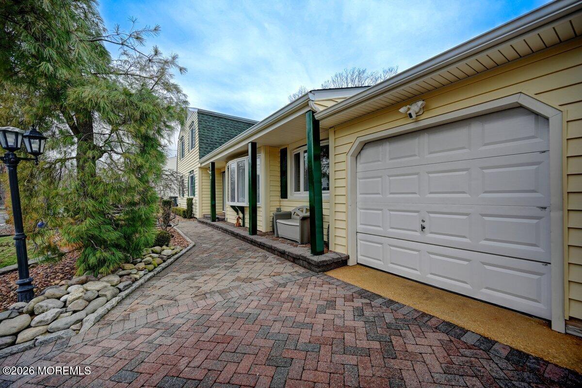 6 Meadowbrook Drive Howell, NJ 07731 - Photo 2 of 24 a view of a back yard of the house