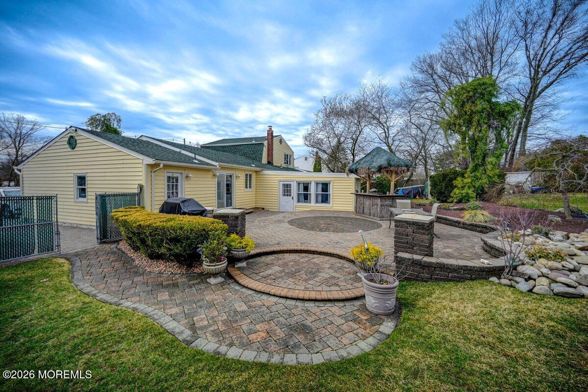 6 Meadowbrook Drive Howell, NJ 07731 - Photo 22 of 24 a view of a house with backyard and sitting area