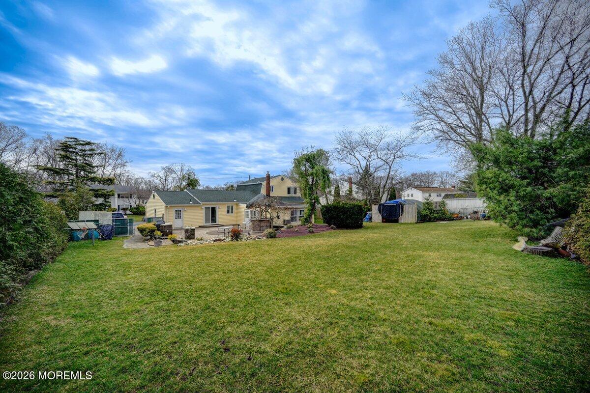 6 Meadowbrook Drive Howell, NJ 07731 - Photo 23 of 24 a view of a house with a big yard and large trees