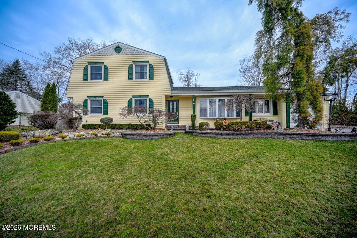 6 Meadowbrook Drive Howell, NJ 07731 - Photo 4 of 24 a front view of house with yard and outdoor seating