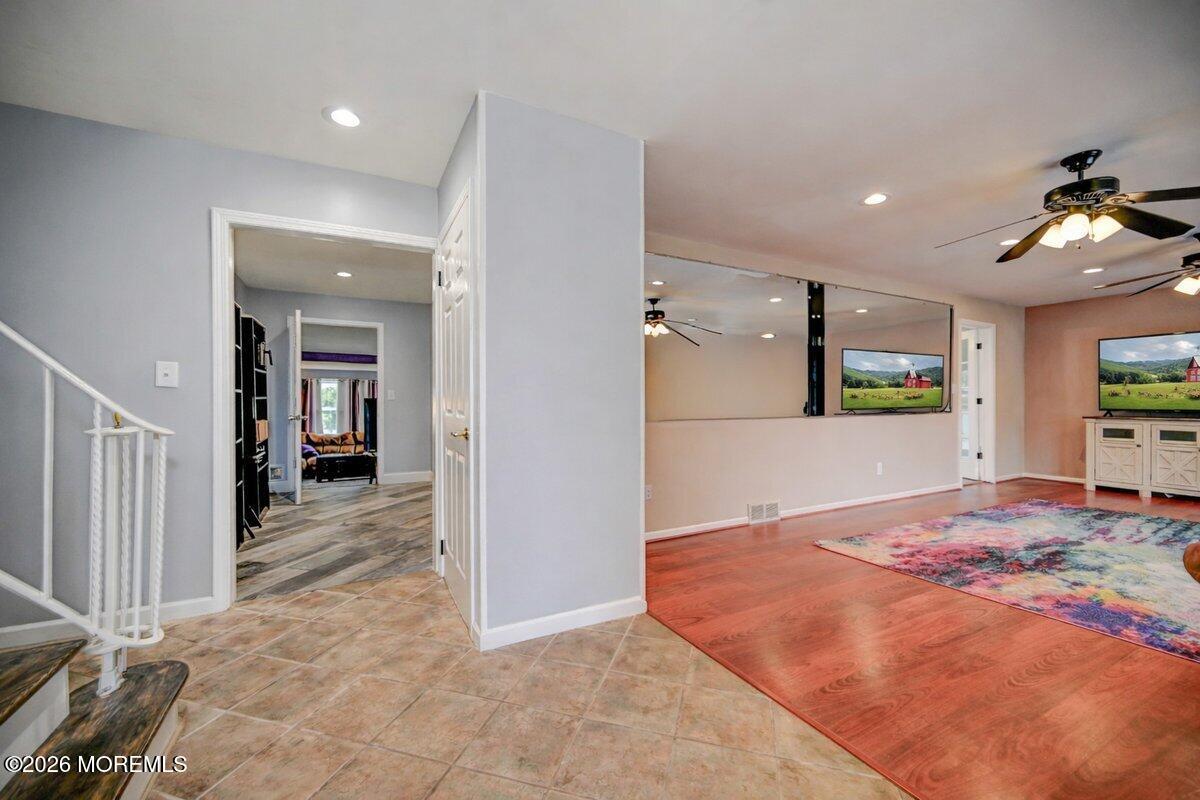 6 Meadowbrook Drive Howell, NJ 07731 - Photo 5 of 24 a view of a hallway to a bedroom and a living room