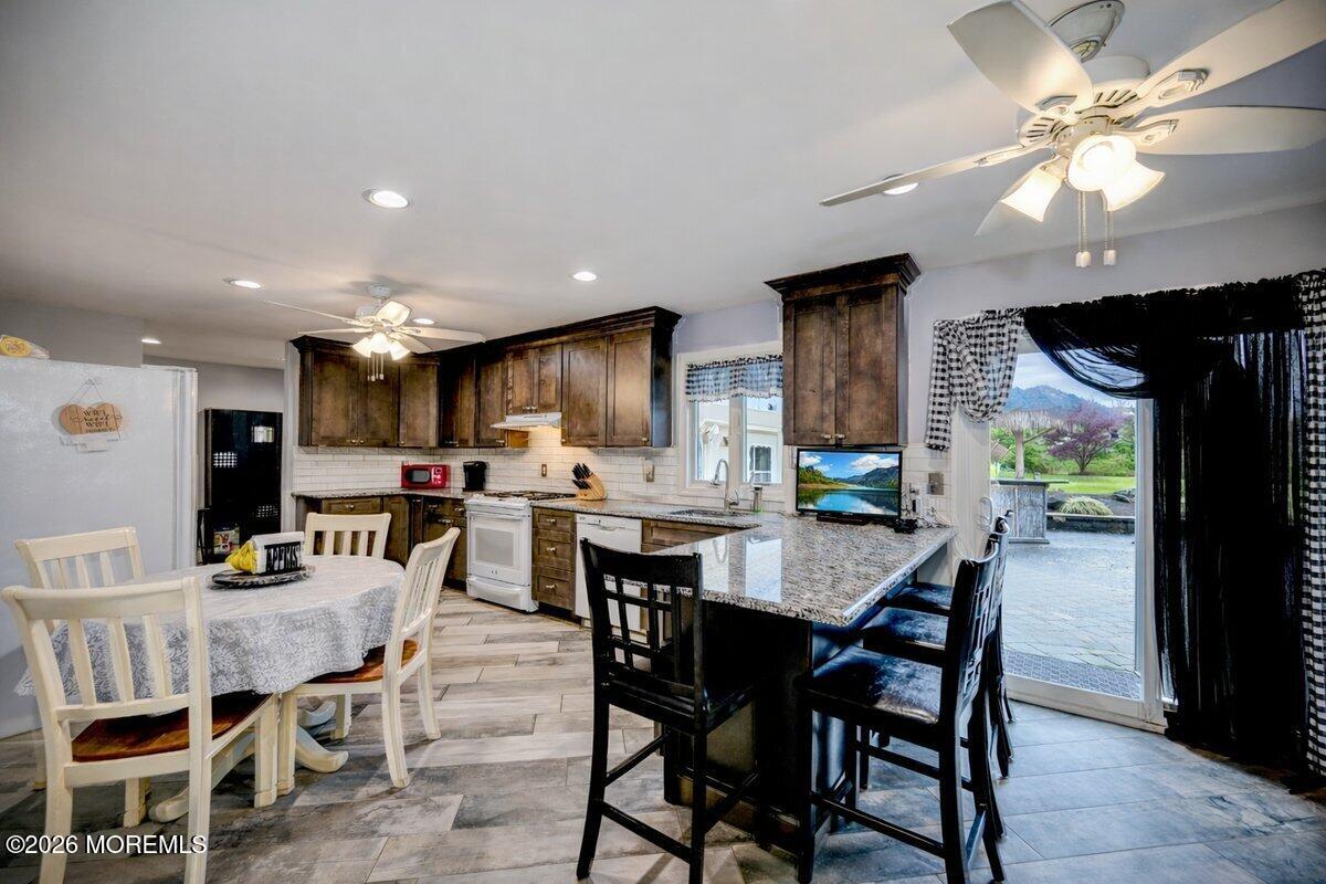 6 Meadowbrook Drive Howell, NJ 07731 - Photo 9 of 24 a view of a dining room with furniture and a livingroom
