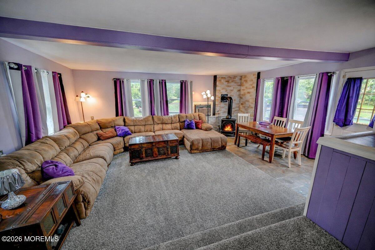6 Meadowbrook Drive Howell, NJ 07731 - Photo 10 of 24 a living room with furniture and a flat screen tv