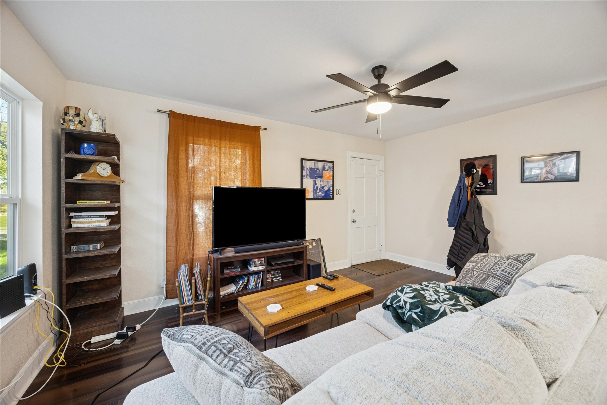 907 East 53rd Street Austin, TX 78751 - Photo 5 of 30 Living area featuring wood finished floors, plenty of natural light, and a ceiling fan