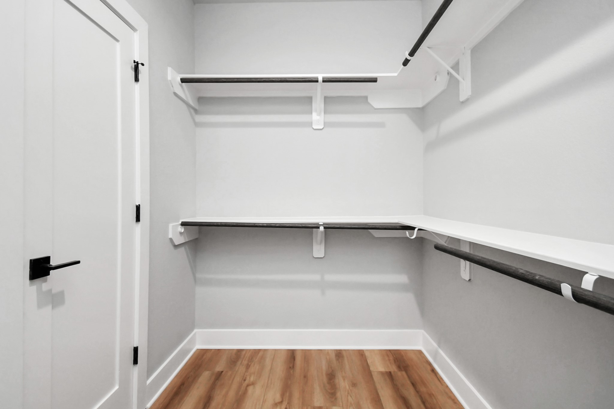 6817 Peerless Street Houston, TX 77021 - Photo 18 of 31 a view of walk in closet with empty racks