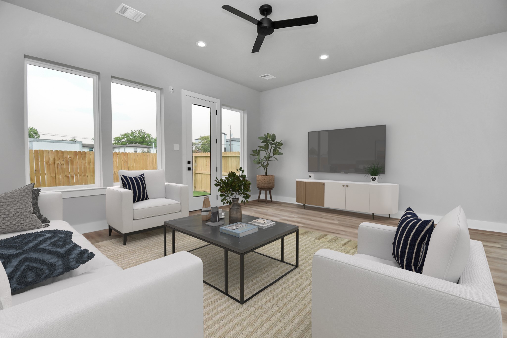 6817 Peerless Street Houston, TX 77021 - Photo 7 of 31 a living room with furniture and a flat screen tv