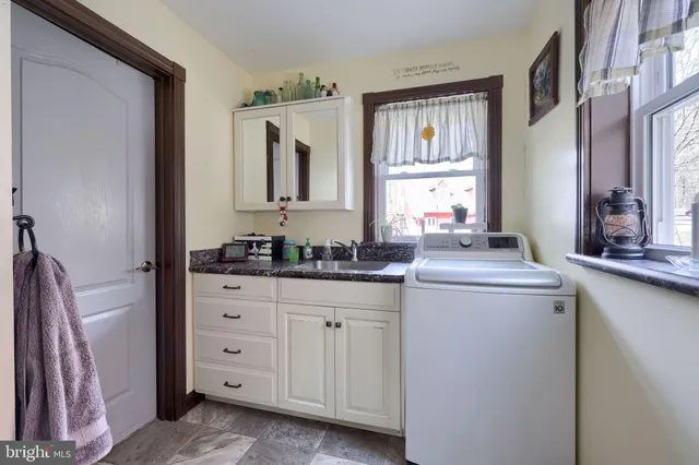 a bedroom with a bed and a potted plant