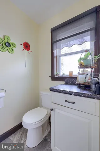 a bed room with a bed and a chair