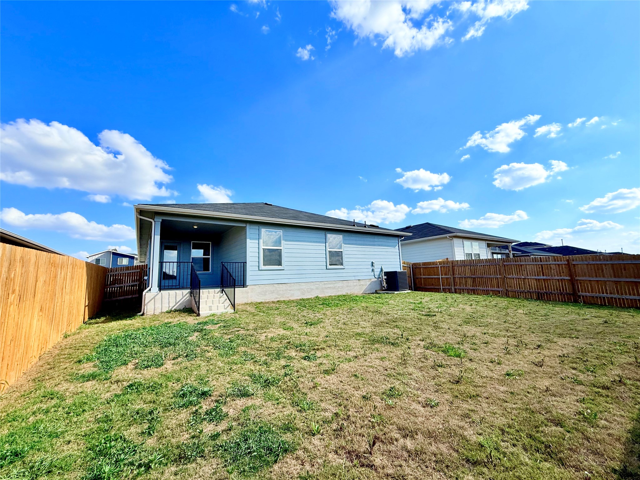 598 Gladiola Loop Kyle, TX 78640 - Photo 33 of 33 Rear view of property featuring a fenced backyard and a patio area