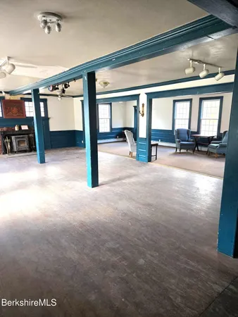 a view of a room with furniture and a window