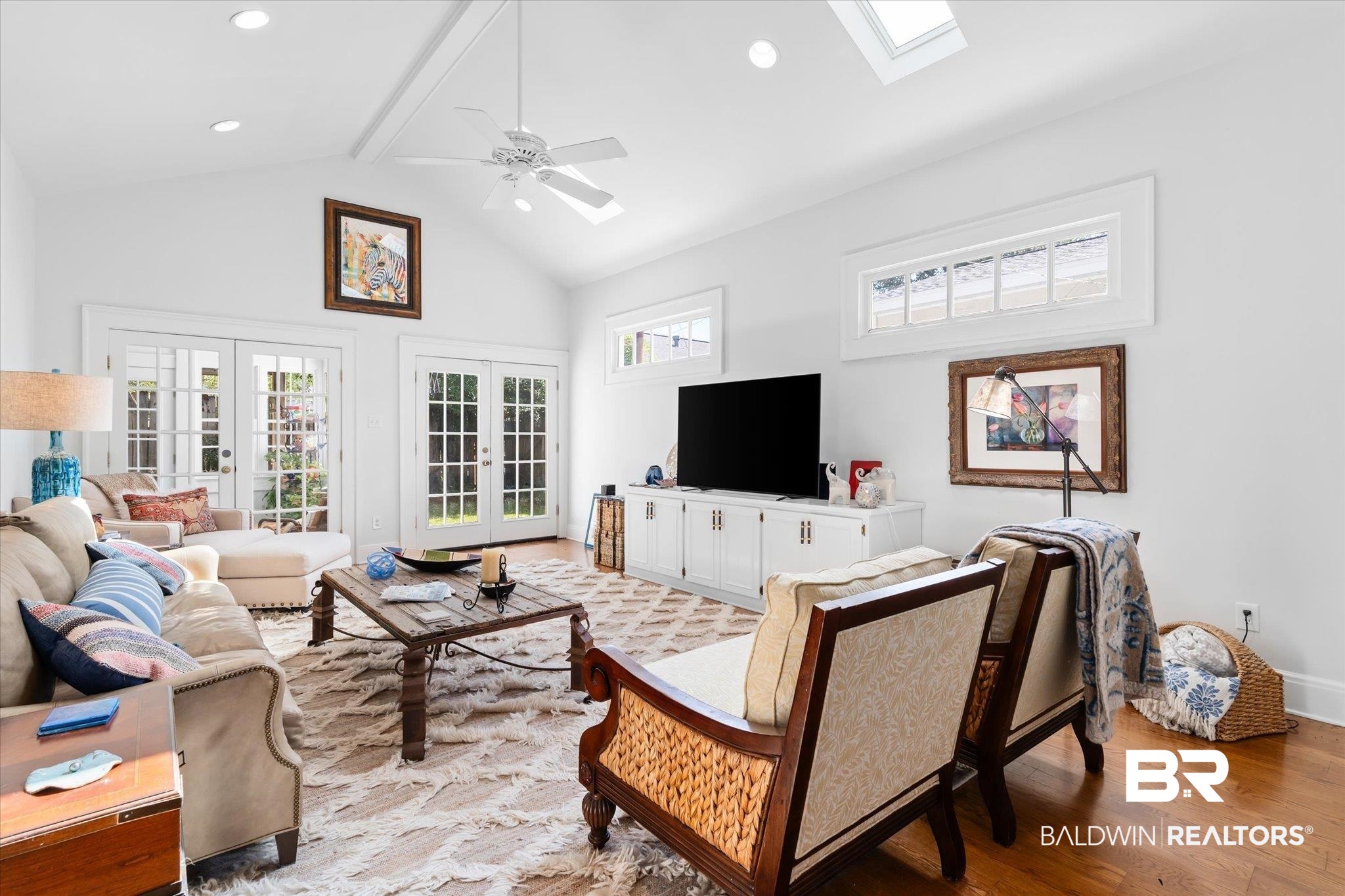 202 Woodlands Avenue Mobile, AL 36607 - Photo 22 of 53 Living room with french doors, ceiling fan, a healthy amount of sunlight, and light hardwood / wood-style flooring
