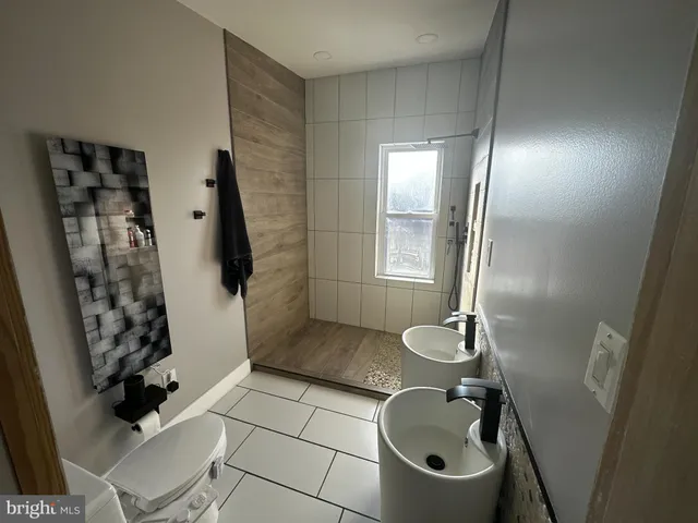 a bathroom with a sink and mirror