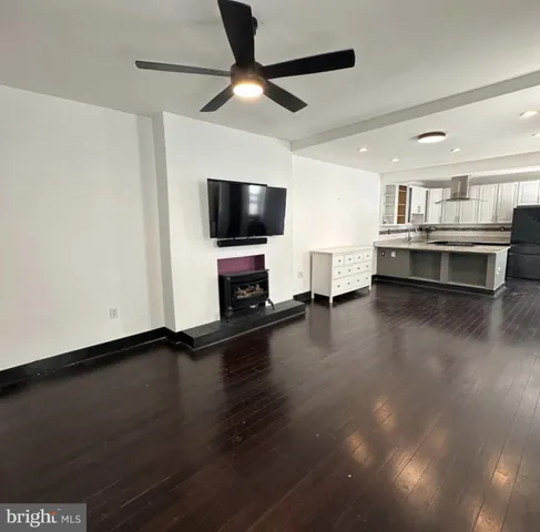 a kitchen with a sink a stove a refrigerator and cabinets