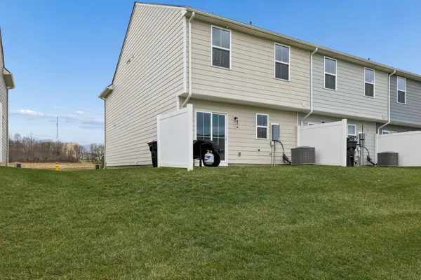 a view of a house with backyard