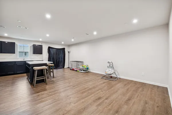 a room with furniture and a wooden floor