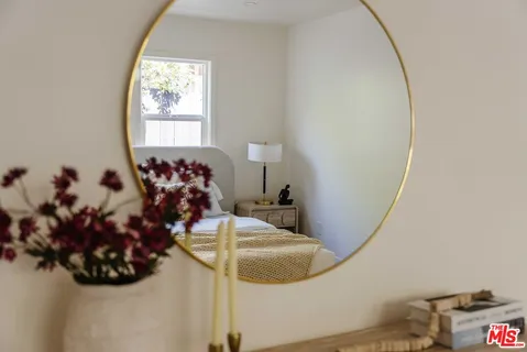 a very nice looking room with a mirror and a window