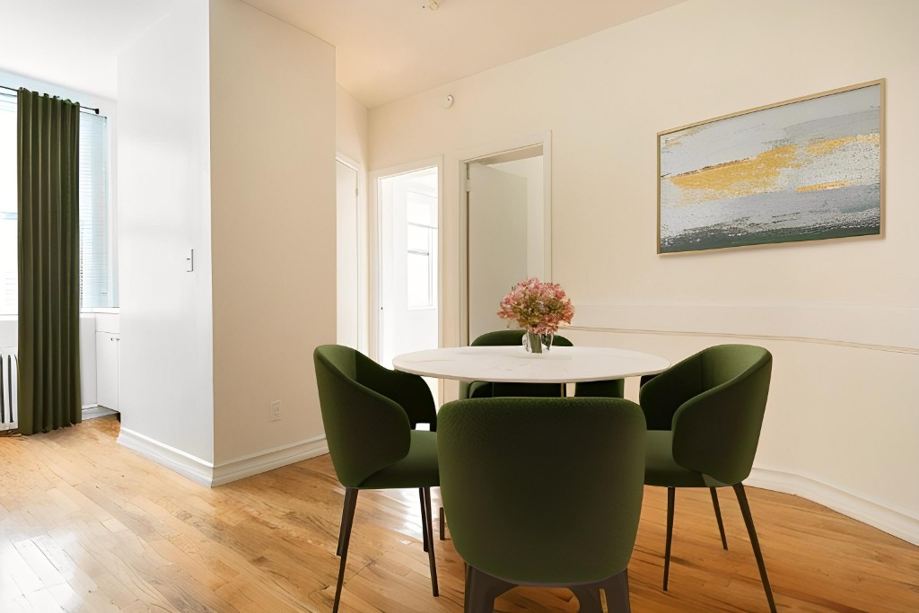 a dining room with furniture and wooden floor