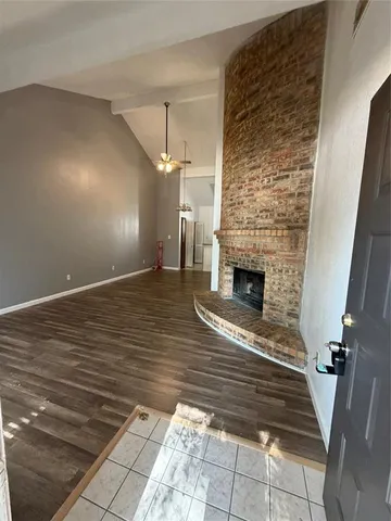 a view of a livingroom with wooden floor